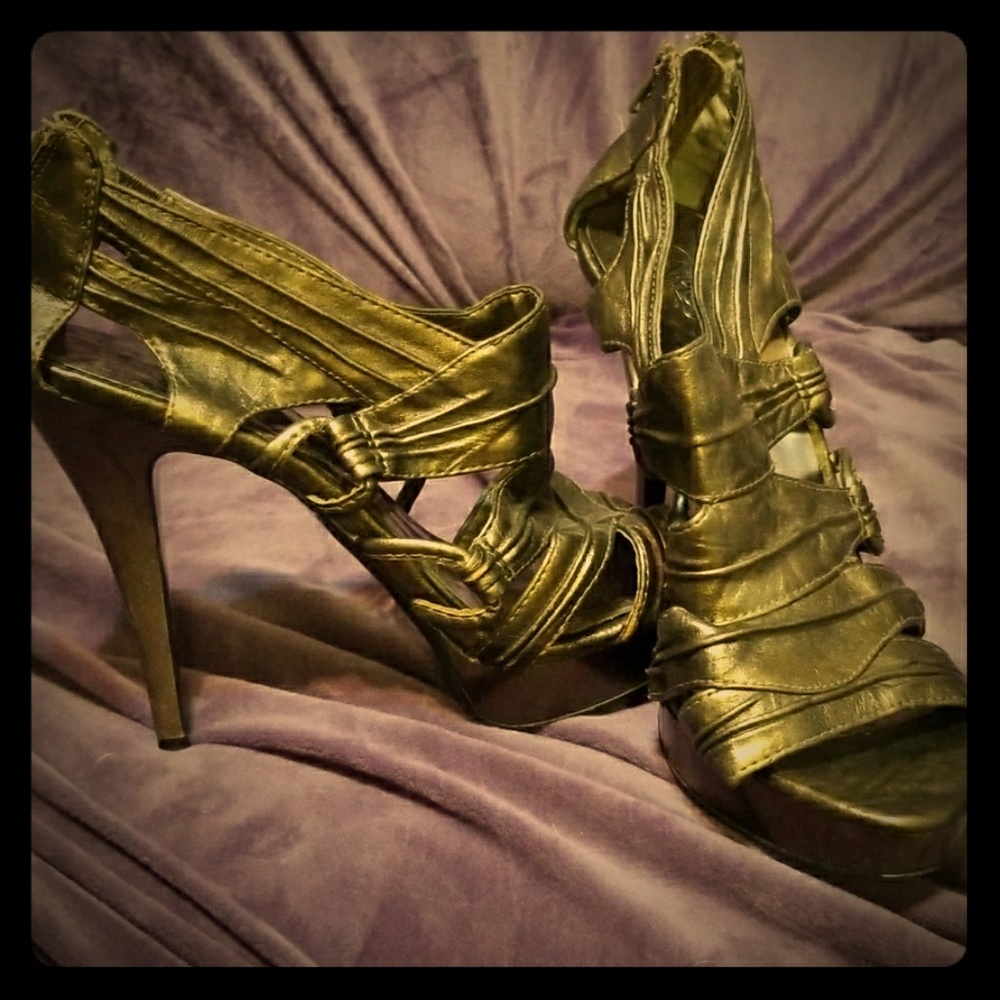 Gold heels by Carlos Santana